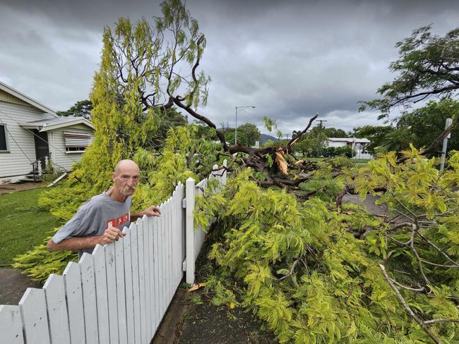 Mundingburra resident Peter Austin was up early assesing the damage from TC Kirrily after a large tree on Oreilly St that missed his front door only by a few centimetres. Photo: Natasha Emeck