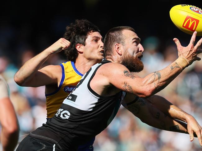 Charlie Dixon competes for a mark against the Eagles. Picture: James Elsby/AFL Photos via Getty Images)