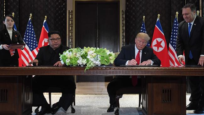 The pair sign their historic agreement in Singapore, after President Trump spoke of their ‘excellent relationship’. Picture: AFP