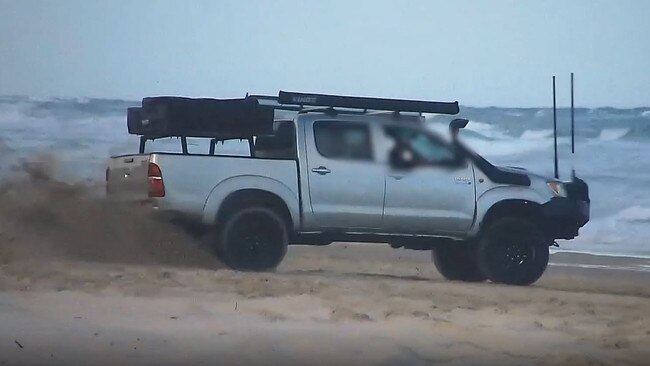 A motorist seen performing burnouts on a Sunshine Coast beach. Picture: QPS