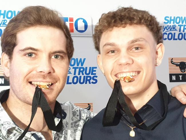 Joint Nichols medallist Brodie Filo, left and Beau O'Connell get a taste of their medals. Picture: GREY MORRIS