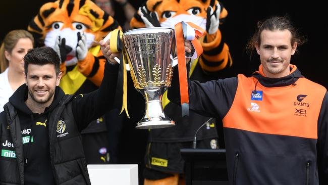 Richmond captain Trent Cotchin and GWS Giants captain Phil Davis hold the AFL Premiership cup aloft at the Grand Final Parade. Picture. Phil Hillyard