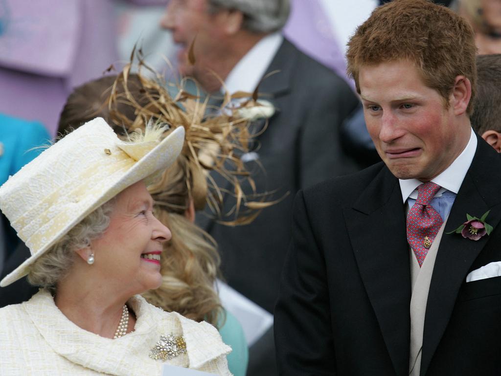 A young Prince Harry with his beloved grandmother, the Queen, on King Charles’ wedding day.