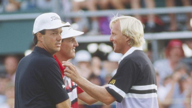 Greg Norman congratulates Mark Calcavecchia on the 18th green. Picture: R&amp;A via Getty Images