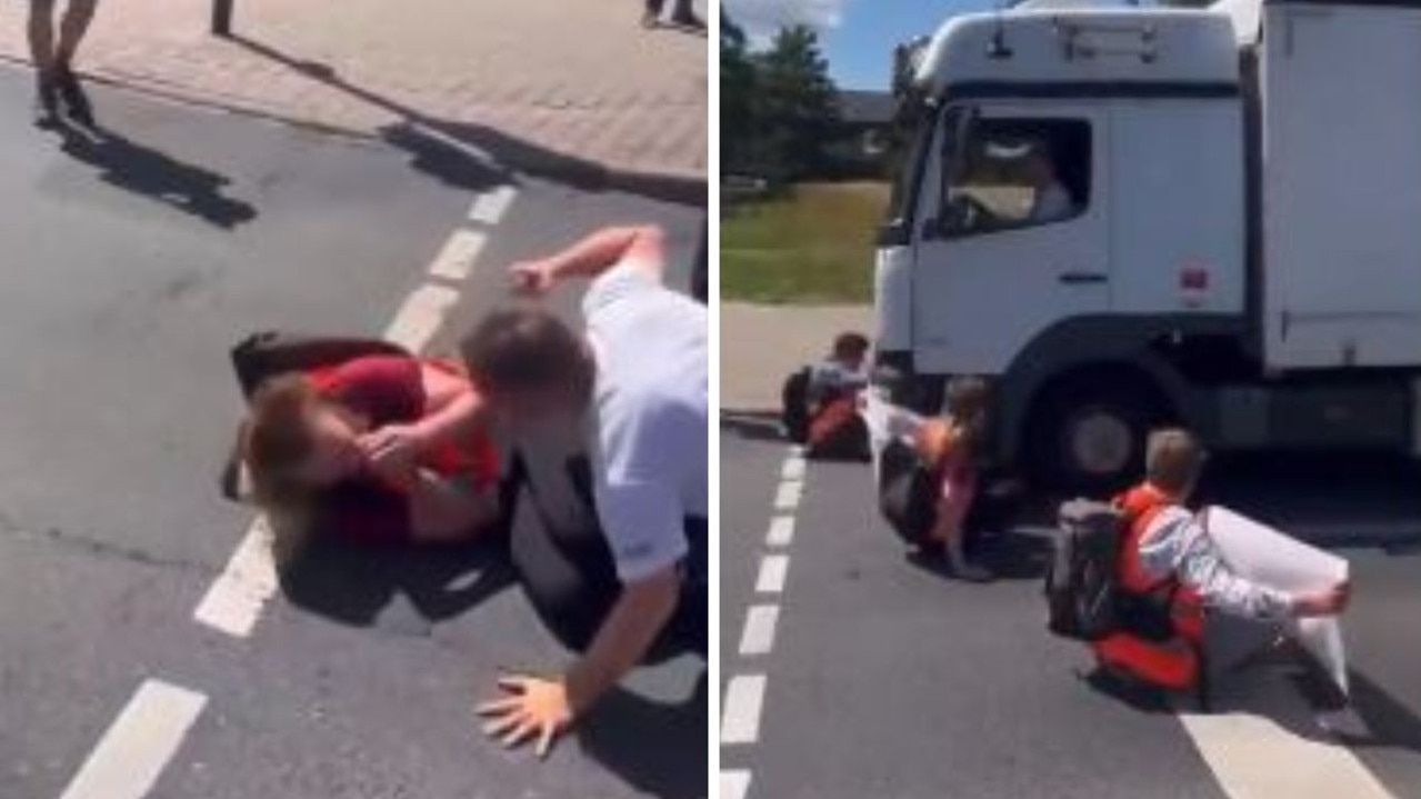 Footage shows truckie wrestling climate protesters