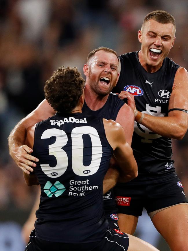 Charlie Curnow and Patrick Cripps celebrate a Docherty goal. Picture: Getty