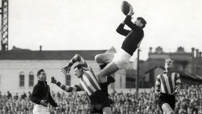 1953. John Coleman marks over Vic Lawrence. North Melbourne v Essendon. HWT ARCHIVAL NEGATIVE.