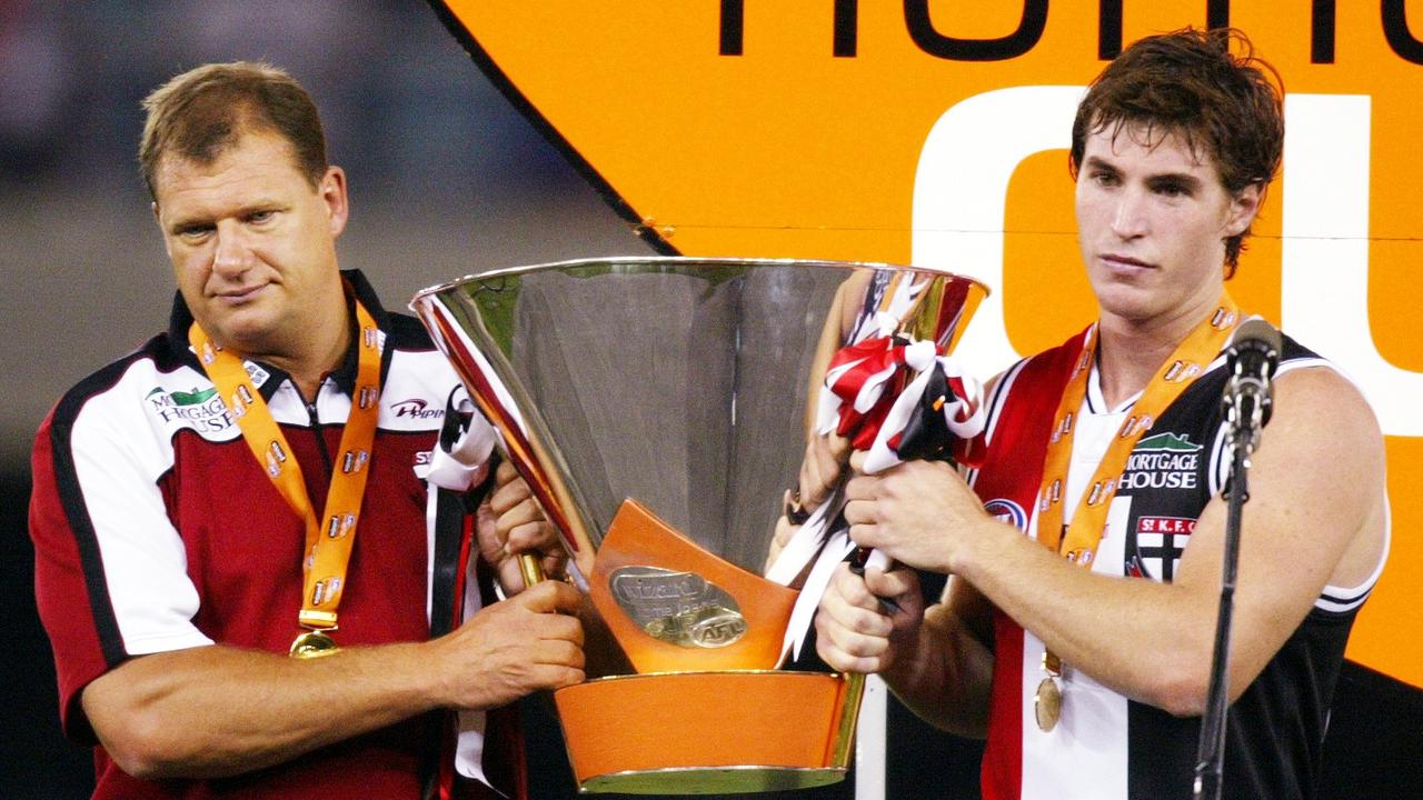Grant Thomas and Lenny Hayes holding the trophy in 2004.
