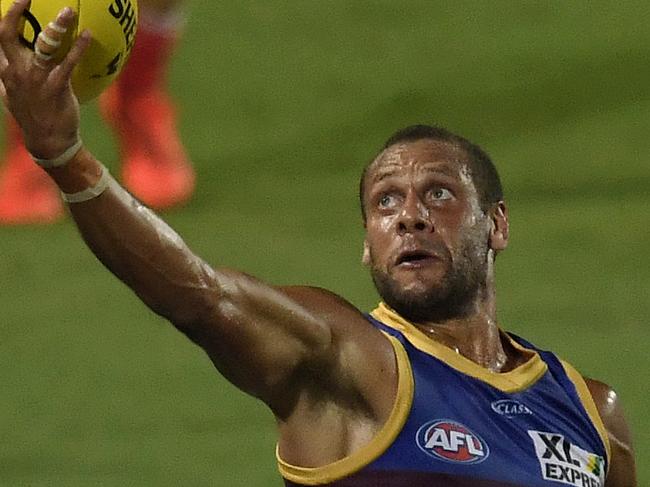 CAIRNS, AUSTRALIA - SEPTEMBER 13: Cameron Ellis-Yolmen of the Lions gets the ball during the round 17 AFL match between the Sydney Swans and the Brisbane Lions at Cazaly's Stadium on September 13, 2020 in Cairns, Australia. (Photo by Ian Hitchcock/Getty Images)