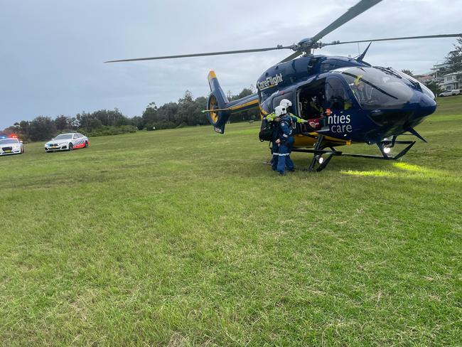 A man in his 50s has been left with life threatening injuries after colliding his motorbike with a car