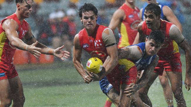 Jack Bowes of the Suns passes during the Round 1 AFL match between the Gold Coast Suns and the North Melbourne Kangaroos at Cazaly's Stadium in Cairns, Saturday, March 24, 2018. (AAP Image/Brian Cassey)