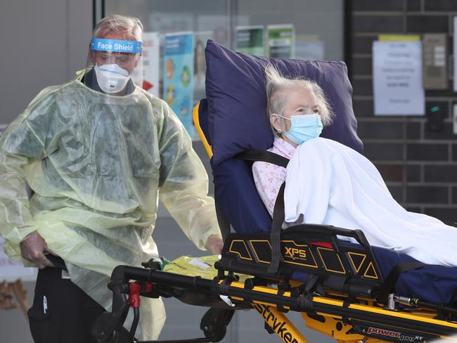 MELBOURNE, AUSTRALIA - NewsWire Photos JULY 30, 2020: A resident is taken to transport out of Epping Gardens Aged Care home which has a COVID-19 breakout. Picture: NCA NewsWire /David Crosling