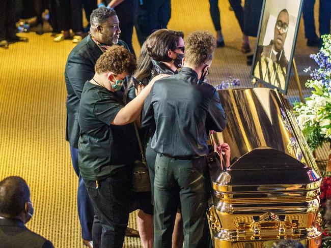 People show their respect to George Floyd at the memorial service. Picture: AFP