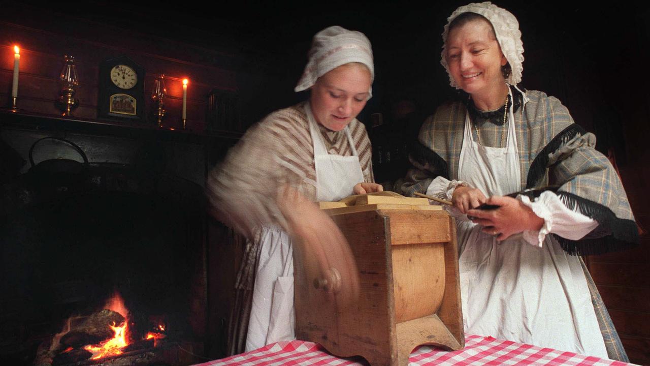 Every household task had to be done by hand, including churning cream into butter. These two women are dressed up in Gold Rush costumes at the living museum Sovereign Hill, Ballarat.