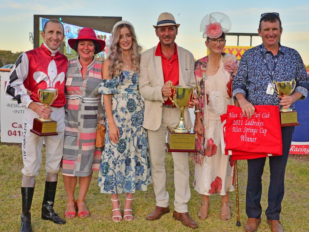 Supplied Editorial Connections of I Am The Fox with the 2021 Alice Springs Cup with
  winning trainer Garry Lefoe Jr holding the cup Picture Nikki Westover