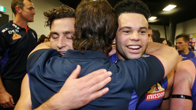 Luke Beveridge hugs Luke Dahlhaus and Jason Johannisen. Picture: Michael Klein