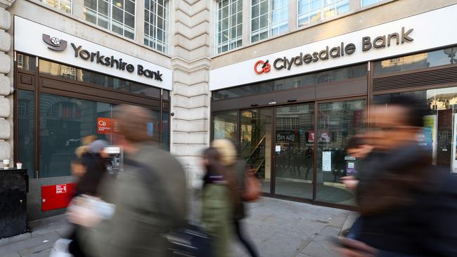 Pedestrians pass branches of Clydesdale Bank and Yorkshire Bank in London. Picture: Bloomberg