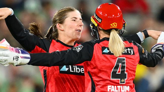 Melbourne Renegades Georgia Wareham (left) and Nicole Faltum celebrate the wicket of Ines McKeon during the Melbourne Derby at the MCG. Picture: Quinn Rooney / Getty Images