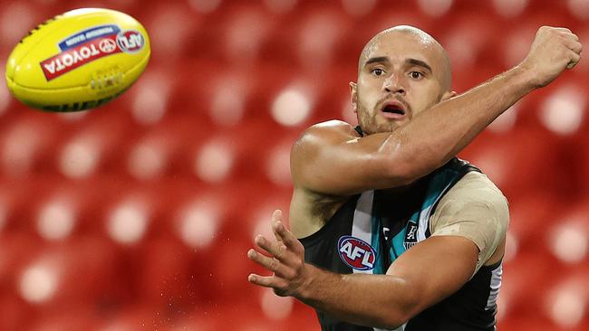 Sam Powell-Pepper playing for Port Adelaide handballs in a game against North Melbourne. Picture: Michael Klein