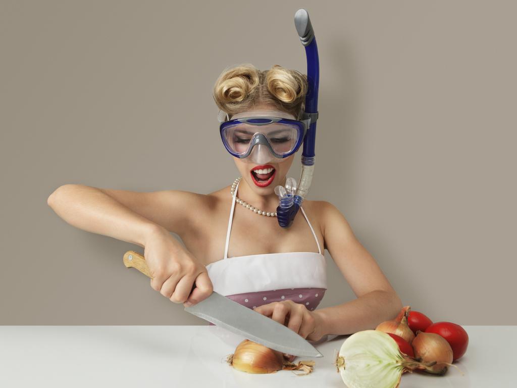 TASTE MATT PRESTON FEB 3 ... Young blonde woman cutting onion in diving scuba mask for protect eyes