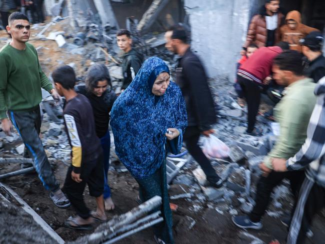 Palestinians check the damages after an Israeli strike in Rafah in the southern Gaza Strip. Picture: AFP