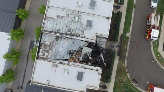 Drone photographs of the damage to the townhouse.