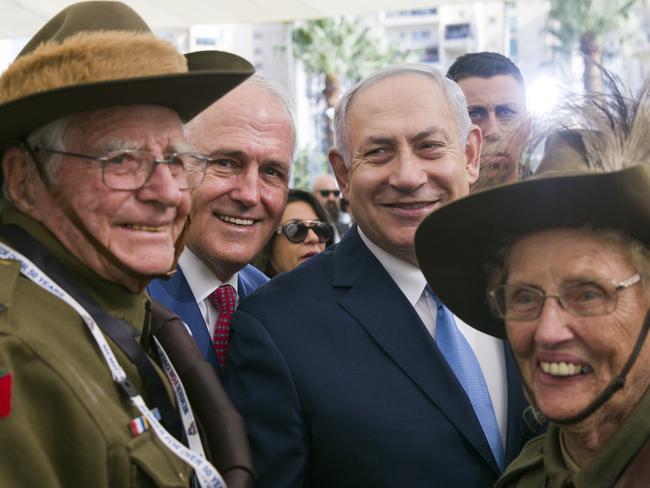 Malcolm Turnbull, centre left, stands with Israeli Prime Minister Benjamin Netanyahu, centre right, as they pose with two Australians wearing uniforms from the 4th Australian Light Horse Brigade from World War I, including Avon Moffatt, right, from Armidale, NSW. Picture: AP.