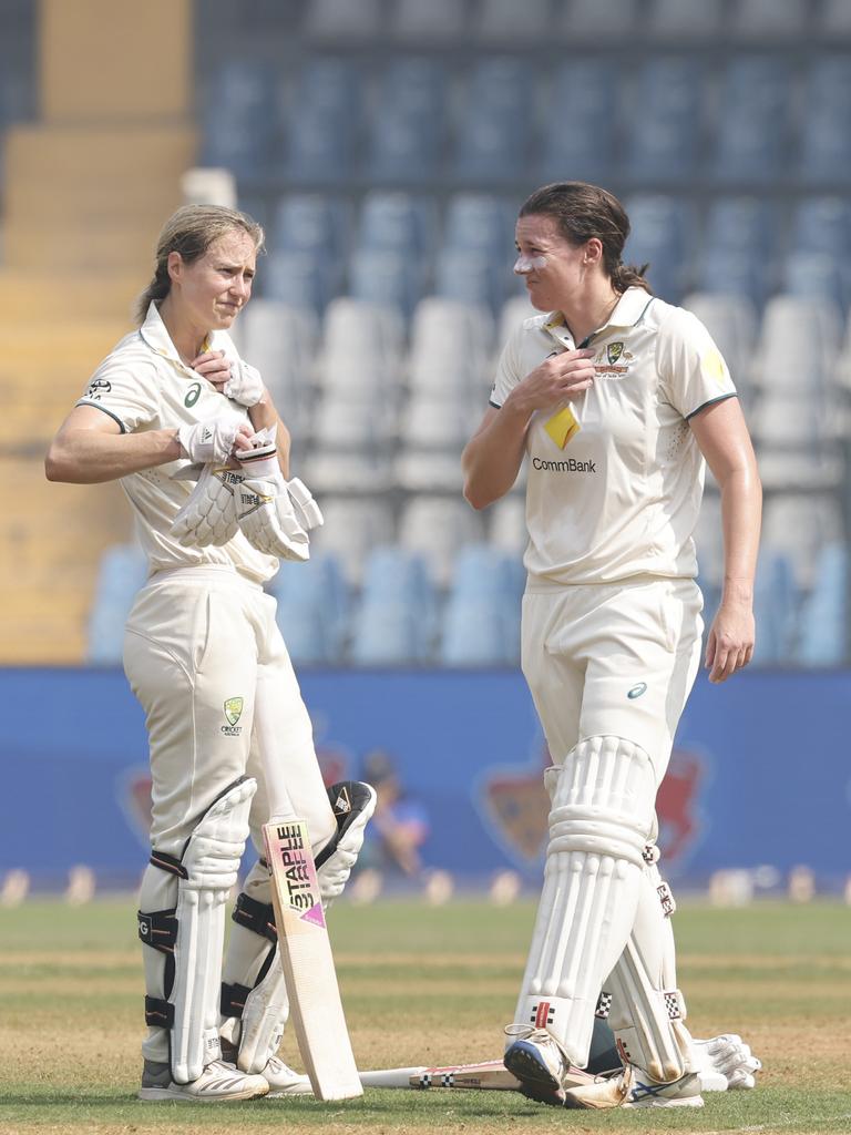 Tahlia McGrath and Ellyse Perry of Australia break for a drink during day three of the Women's Test Match at Mumbai. Picture: Pankaj Nangia/Getty Images