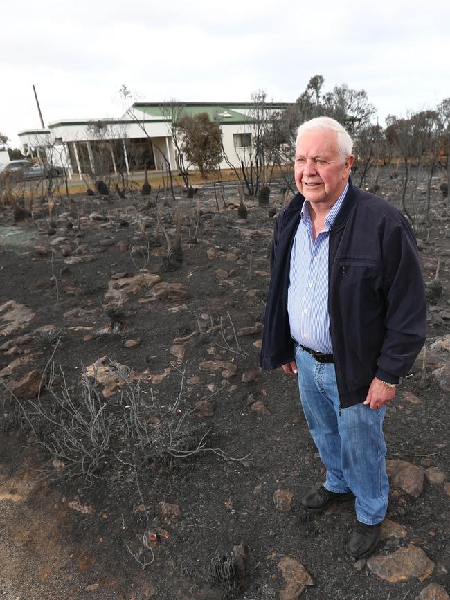 Tom McNab outside his home, which was saved. Picture: Tait Schmaal