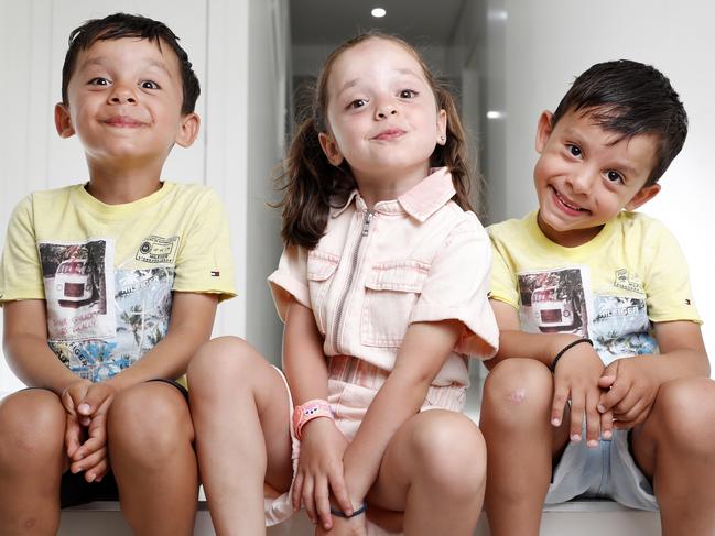 Triplets Alexia, Luis, and Tristan Georgas, 5, at home in Ermington for a story about how kids accents change once they enter school. Picture: Jonathan Ng