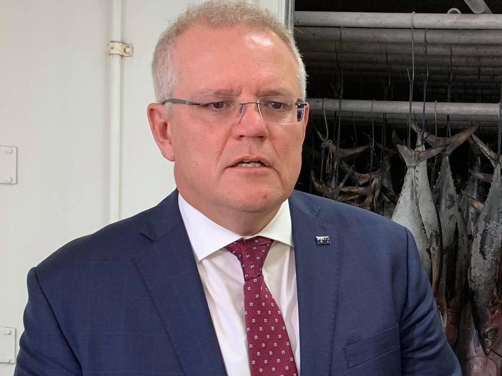 Prime Minister Scott Morrison visited Mooloolaba for a tour of Walker Seafoods on Tuesday morning. He's pictured with Walker Seafoods owner Heidi Walker.