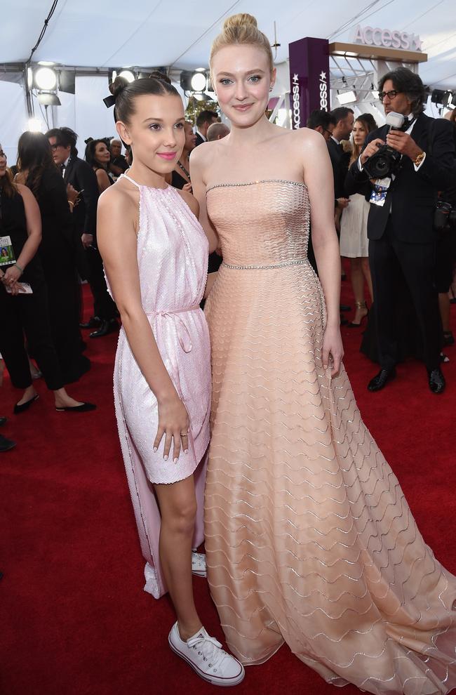 Millie Bobbie Brown and Dakota Fanning attend the 24th Annual Screen Actors Guild Awards at The Shrine Auditorium on January 21, 2018 in Los Angeles, California. Picture: Getty