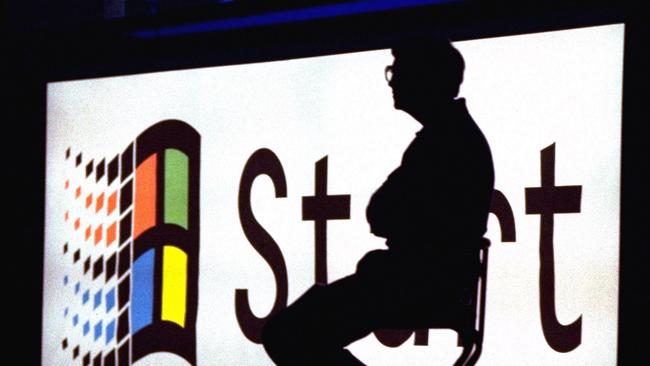 Bill Gates sits on stage during a video portion of the Windows 95 Launch Event in 1995. Picture: AP