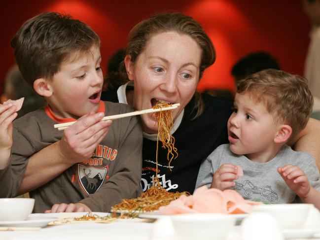 Anne Picalovski with her kids Damon, 4, and Dylan, 2, enjoying noodles in 2005. Picture: Dean Marzolla