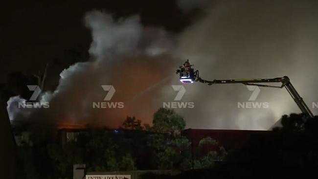 Firefighters spent hours battling a blaze which broke out in a Molendinar industrial complex on Monday night. Picture: 7 News