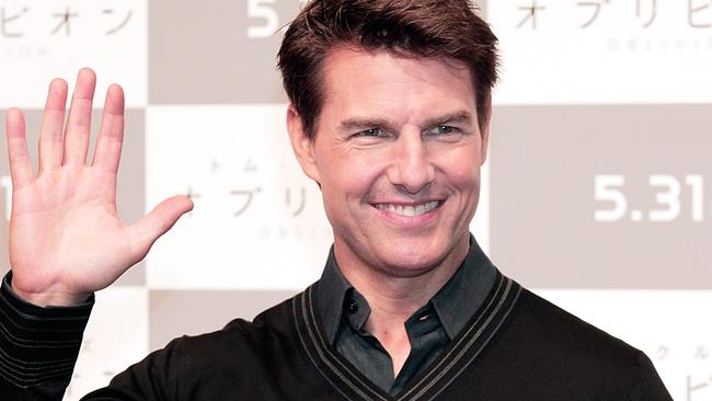 TOKYO, JAPAN - MAY 07: Actor Tom Cruise poses for photographers before attending the 'Oblivion' press conference at Ritz Carlton Tokyo on May 7, 2013 in Tokyo, Japan. (Photo by Adam Pretty/Getty Images)