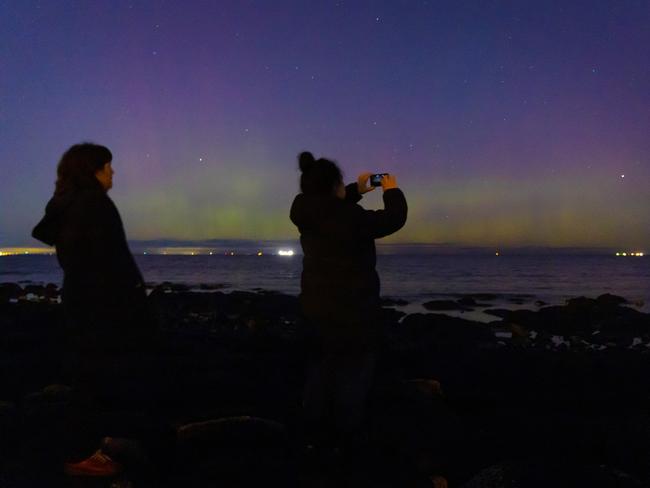 Aurora chasers view Aurora Australis at Williamstown. Picture: Mark Stewart