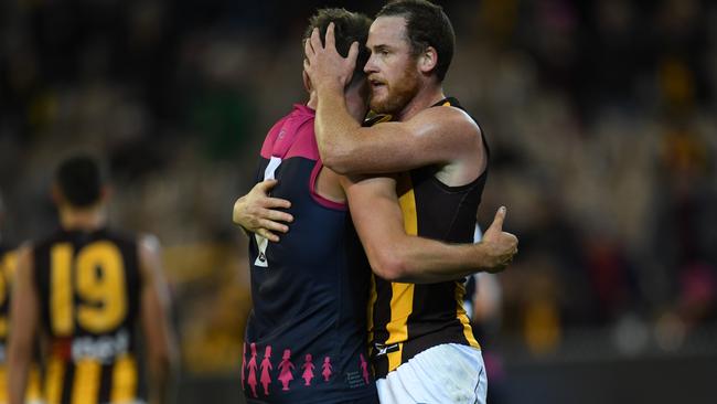 Jesse Hogan embracing Jarryd Roughead after the Demons and Hawks clashed in Round 7. Picture: AAP Images