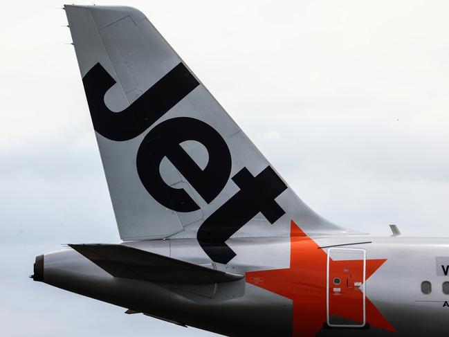 SYDNEY, AUSTRALIA - JANUARY 20: The Jetstar logo displayed on an aircraft tail at Sydney Airport  on January 20, 2024 in Sydney, Australia. Transport Minister Catherine King signed off on a deal that will allow Turkish Airlines to start serving the Australian market, rising to 35 flights a week by 2025. The decision came as the government was under mounting criticism from many for a perception that it was protecting the profits of Qantas and stymying competition in the market by limiting additional capacity for other carriers, such as Qatar Airways. (Photo by Jenny Evans/Getty Images)