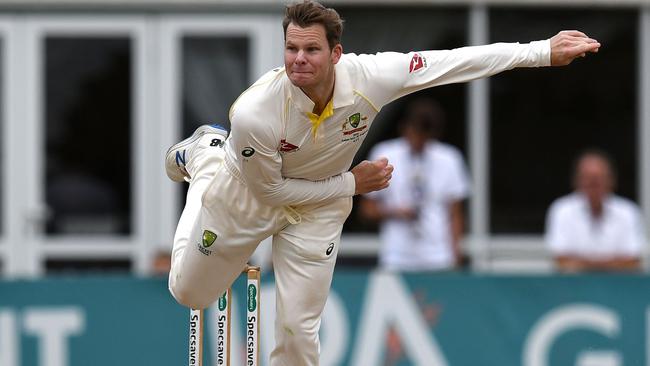 Steve Smith bowls on day one of the three-day match against Derbyshire. Picture: AFP