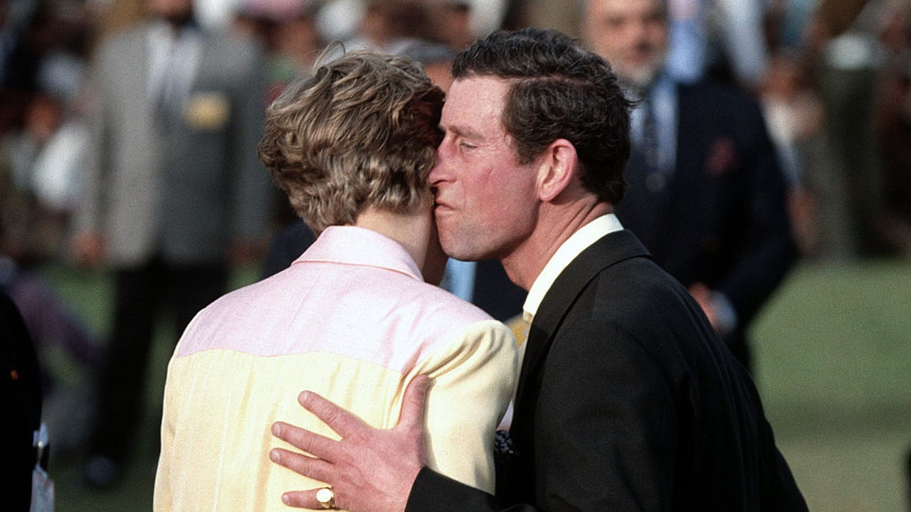 Princess Diana and Prince Charles caught in an awkward embrace during a prize-giving ceremony at a polo match in February 1992. Picture: Anwar Hussein/Getty Images