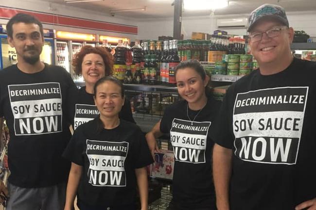 Moulden Supermarket owner Helen Harvey (back) made shirts for her staff in support of soy sauce. Picture: Helen Harvey