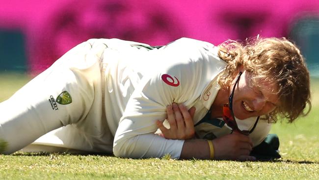 Will Pucovski clutches his shoulder after diving for the ball. Picture: Getty Images