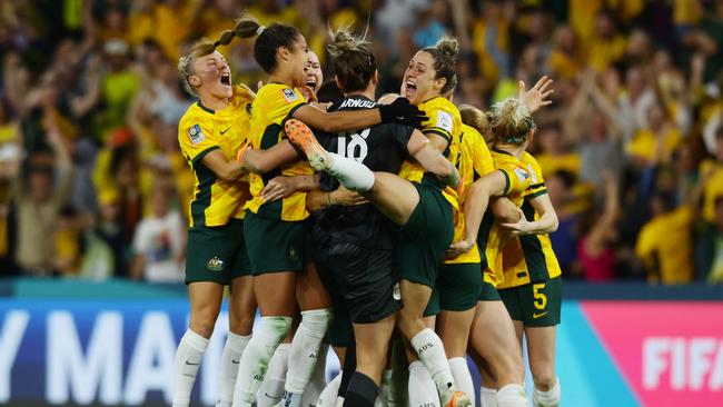 Matildas players celebrate winning the FIFA Womens World Cup quarterfinal match against France at Brisbane Stadium. Picture: Lachie Millard