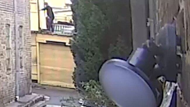 CCTV footage of a man at the back of the Surry Hills building. Source: NSW Police