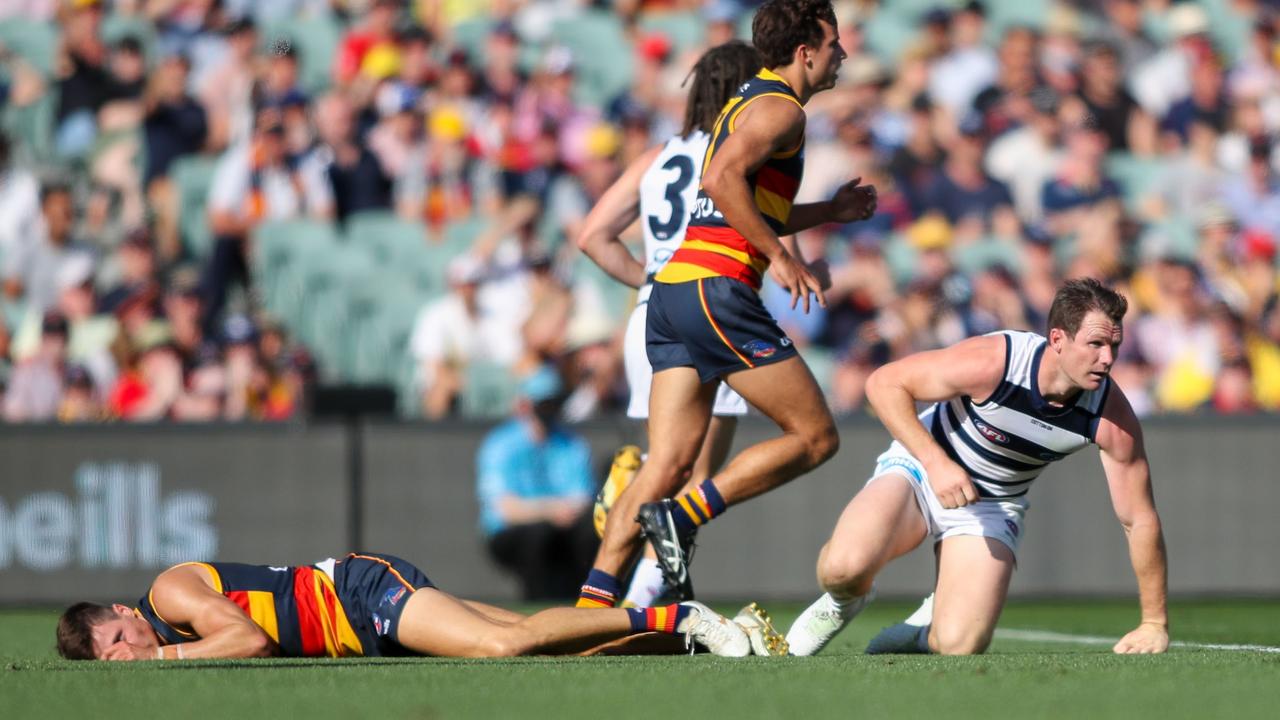 Patrick Dangerfield and Jake Kelly collide. Picture: AAP Image/Matt Turner