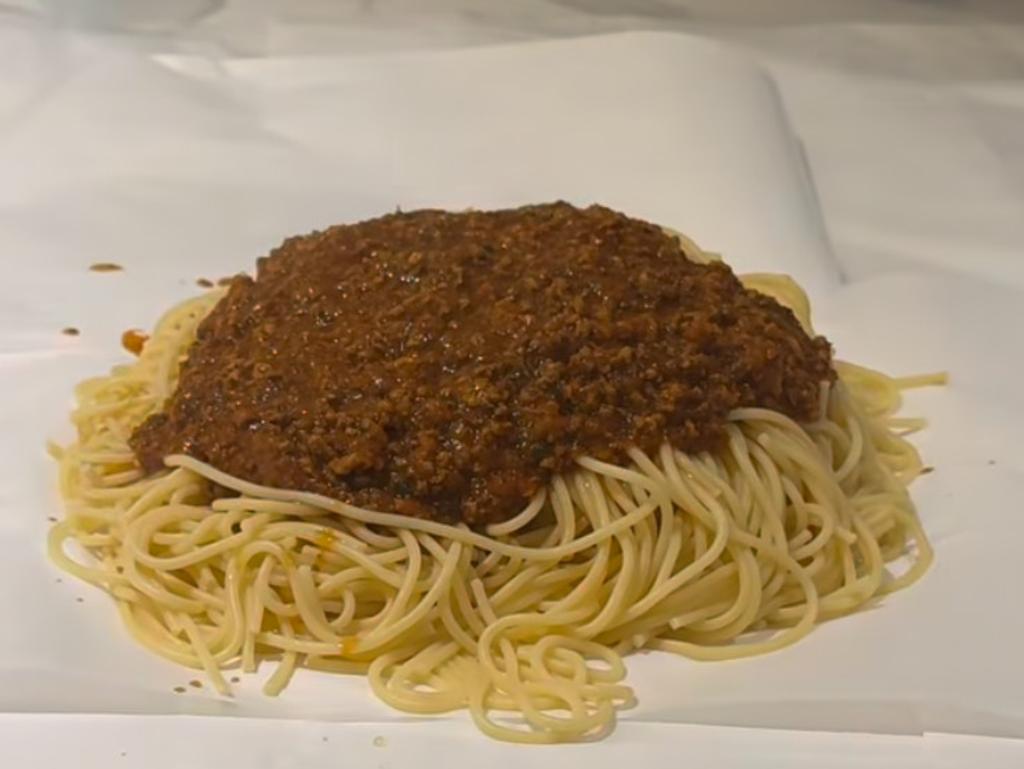 The pasta is served on baking paper.
