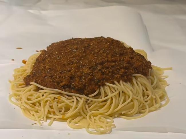 The pasta is served on baking paper.