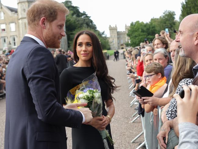 Prince Harry, Duke of Sussex and Meghan, Duchess of Sussex speak with members of the public at Windsor Castle. Picture: Chris Jackson – WPA Pool/Getty Images