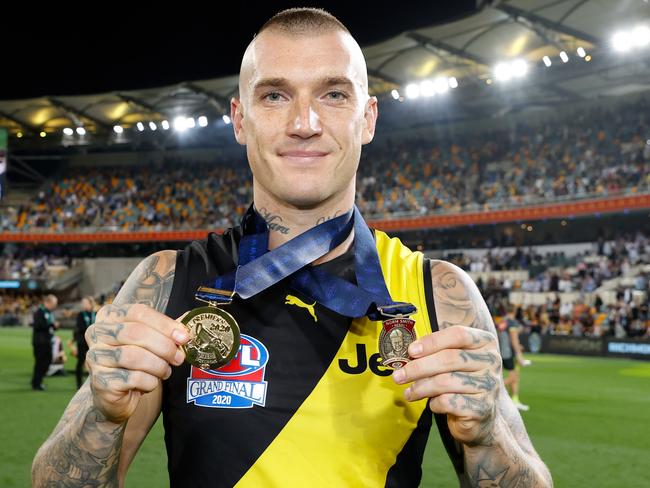 BRISBANE, AUSTRALIA - OCTOBER 24: Dustin Martin of the Tigers celebrates with his Norm Smith Medal and Premiership Medal during the 2020 Toyota AFL Grand Final match between the Richmond Tigers and the Geelong Cats at The Gabba on October 24, 2020 in Brisbane, Australia. (Photo by Michael Willson/AFL Photos via Getty Images)